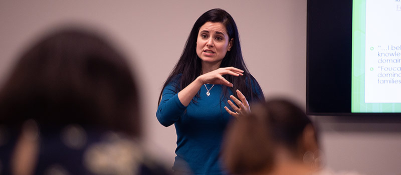 Female professor talking to class