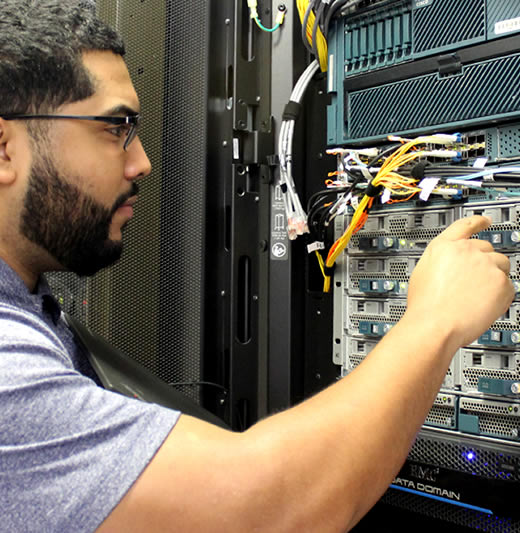 Male student working on network server