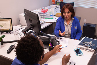 Finanical aid counselor helping student